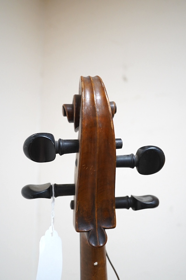 A late 19th century small cello, unsigned and without label inside body, stamped inventory number 769, length of back 62cm. Condition - poor to fair